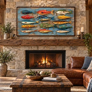 May include: A rectangular wall art piece featuring a collection of twelve colorful metal fishing lures arranged in rows on a weathered blue wooden background, displayed above a stone fireplace in a living room setting with leather furniture.