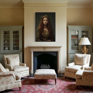 a cozy living room with a fireplace, two armchairs, a sofa, and a large painting of a woman with long red hair.
