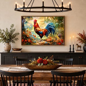 May include: A rectangular wall art print featuring a vibrant rooster with red, orange, and blue plumage standing in a lush, colorful forest setting with autumn leaves, displayed in a thin wooden frame above a long black sideboard cabinet.