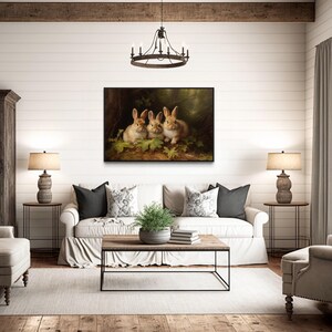 a cozy living room with a large painting of three rabbits on the wall, a wooden coffee table, a sofa, and two armchairs.