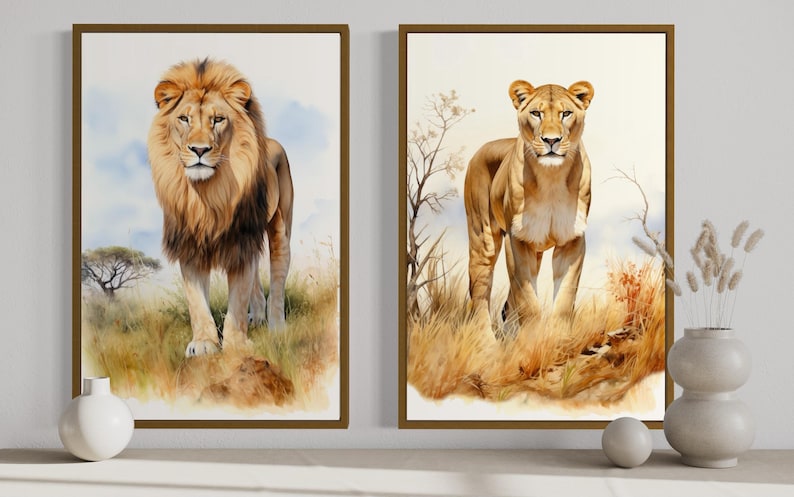 two framed paintings of lions, one standing and one walking, set against a natural landscape with grass and trees.