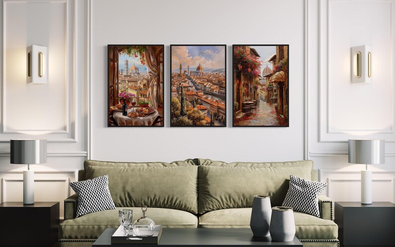 a modern living room with a green sofa, a coffee table, and three framed paintings hanging on the wall above it.