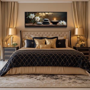 a luxurious bedroom with a large bed, plush bedding, and a framed artwork featuring a still life of flowers and stones on the wall.