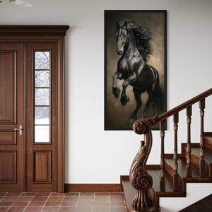 a large black horse in mid-gallop, captured in a striking black and white photograph, which is prominently displayed on the wall above a wooden staircase.