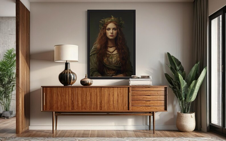 a wooden cabinet with a lamp and a framed portrait of a woman with long red hair, which is hanging on the wall above the cabinet.