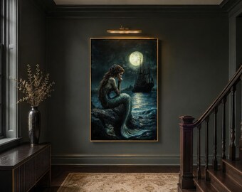 May include: A rectangular wall art print featuring a dark, atmospheric scene of a mermaid with long hair sitting on a rocky shore. In the background, a large full moon illuminates the night sky and a dark sailing ship on the calm ocean water.