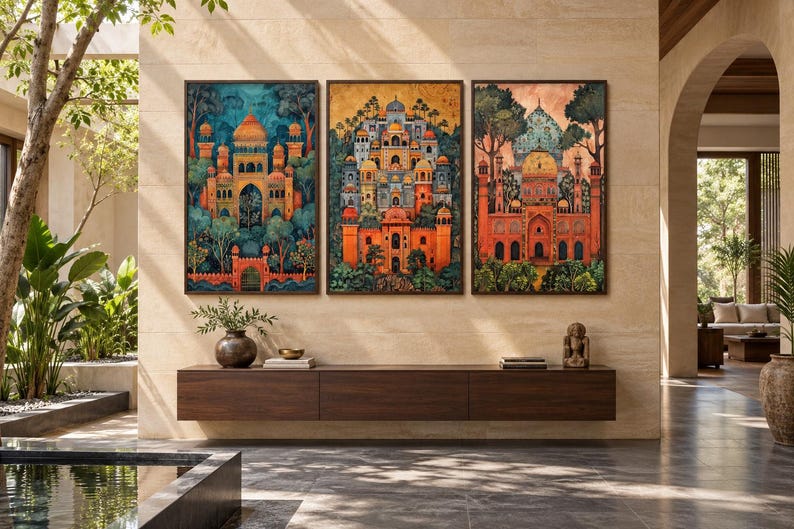May include: A set of three framed rectangular wall art prints featuring intricate architectural structures with domes and arches, rendered in vibrant shades of orange, teal, and gold, displayed above a long, dark brown wooden console table.