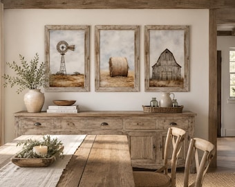 May include: A set of three framed wall art prints featuring a windmill, a hay bale, and a barn, displayed above a long wooden sideboard. The prints are housed in weathered wood frames and depict rural scenes with muted brown and beige tones.