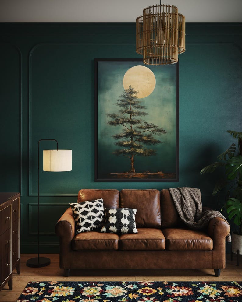 a cozy living room with a brown leather sofa, a wooden floor lamp, and a large painting of a tree on the wall.