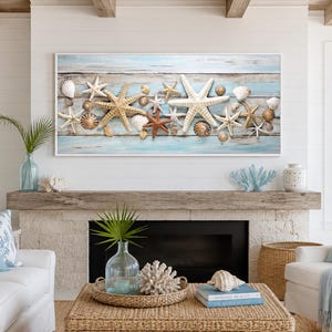 May include: A rectangular wall art print featuring a collection of various starfish and seashells arranged horizontally against a background of weathered, light blue and white horizontal wooden planks, framed in a simple white border.