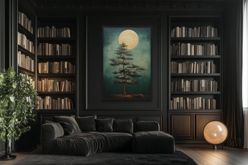 a cozy living room with a large bookshelf filled with books, a comfortable black sofa, and a large painting of a tree with a full moon in the background.