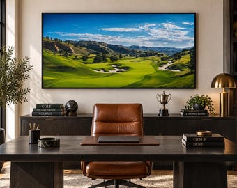 May include: A home office featuring a large dark wood desk with a brown leather chair, a laptop, and a black pen holder. A wall-mounted television displays a golf course landscape. Books titled Golf are stacked on the desk and a side cabinet.