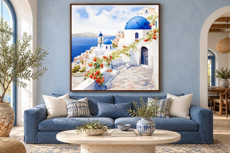 May include: A square wall art print featuring a Mediterranean coastal scene with white buildings, bright blue domes, and a stone pathway. Vibrant orange flowers drape over a white wall in the foreground, overlooking a deep blue sea under a clear sky.
