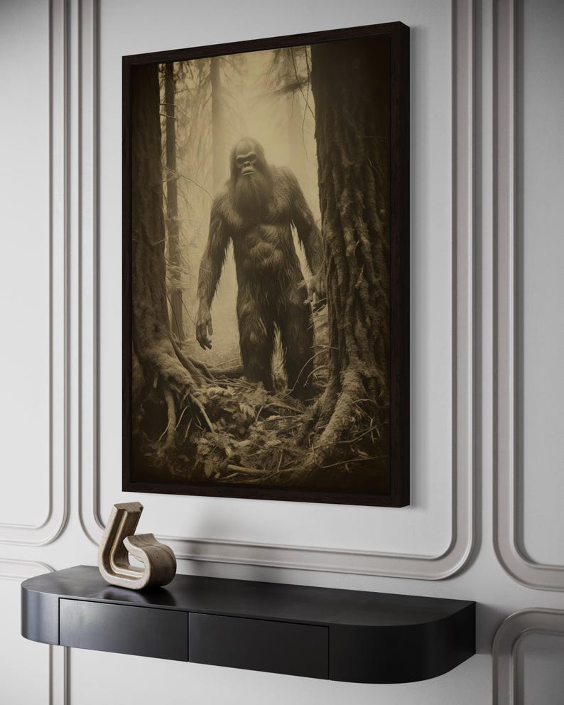 a large black and white photograph of a Sasquatch, a mythical creature, standing in a forest setting.