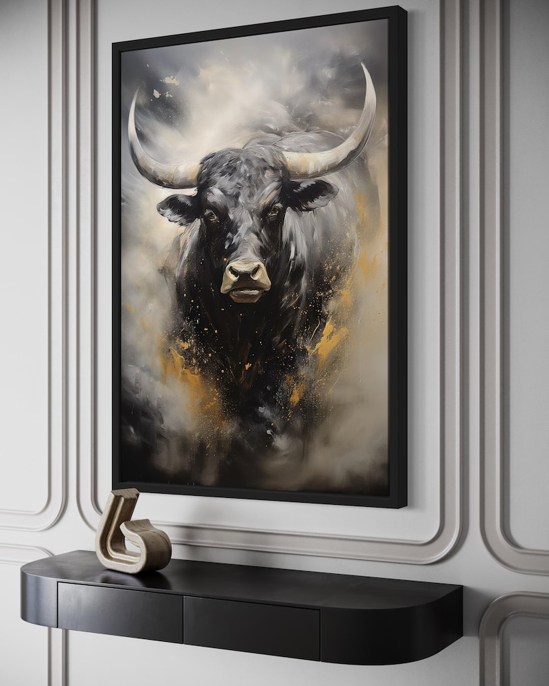 a large black bull with prominent horns, which is the central focus of the artwork displayed on the wall.