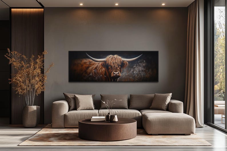 a large, brown cow with horns on the wall, serving as a striking focal point in a modern living room setting.