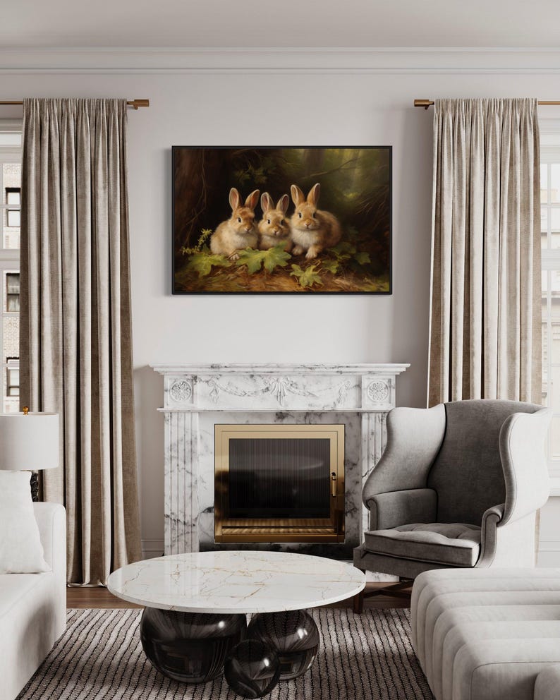 a cozy living room with a fireplace, a painting of three rabbits, and a marble fireplace surround. The room is furnished with a sofa, a chair, and a coffee table. The overall atmosphere of the room is warm and inviting, with the painting of the rabbits adding a touch of nature and charm to the space.