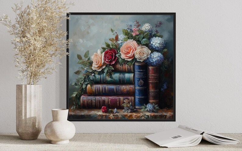 A framed painting of a bouquet of flowers and books is displayed on a wall, with a vase of dried flowers and a book on a shelf below it.