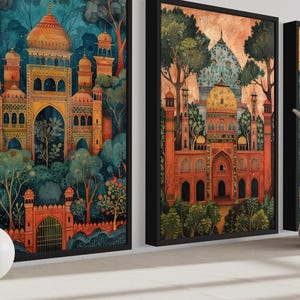 three framed paintings of ornate, colorful buildings with intricate architectural details, displayed on a wall.