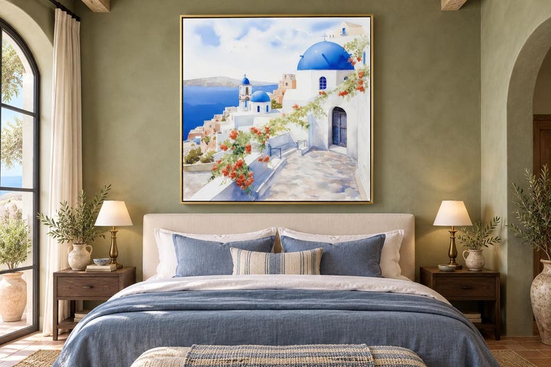 May include: A square wall art print featuring a painting of a Mediterranean coastal village with white buildings, iconic blue domes, and vibrant orange flowers cascading over a stone wall, all set against a deep blue sea and sky.