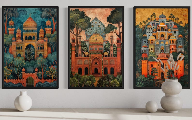 three framed paintings of ornate, colorful buildings set against a lush, green landscape. The paintings are arranged in a row on a wall, with a vase and two white bowls placed in front of them.