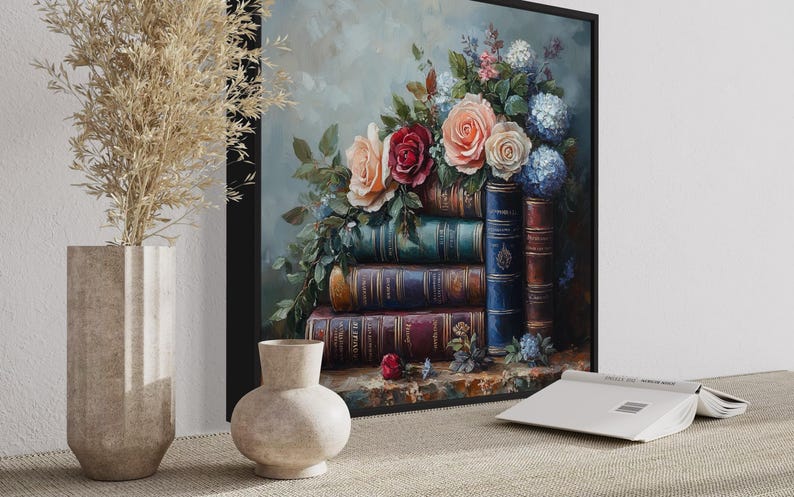 a painting of a bouquet of flowers on a bookshelf, with a vase of dried flowers and a book on a table in front of it.