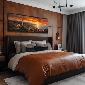 a modern bedroom with a large bed, dark wood paneling, and a large window. The bed is covered in a brown leather comforter and has a framed landscape painting above it. The room has a warm, inviting atmosphere with the wooden paneling and the natural light coming through the window.