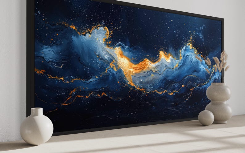 a large abstract painting with swirling blue and orange colors, creating a sense of movement and energy. The painting is displayed on a wall, with two white vases placed on either side of it.