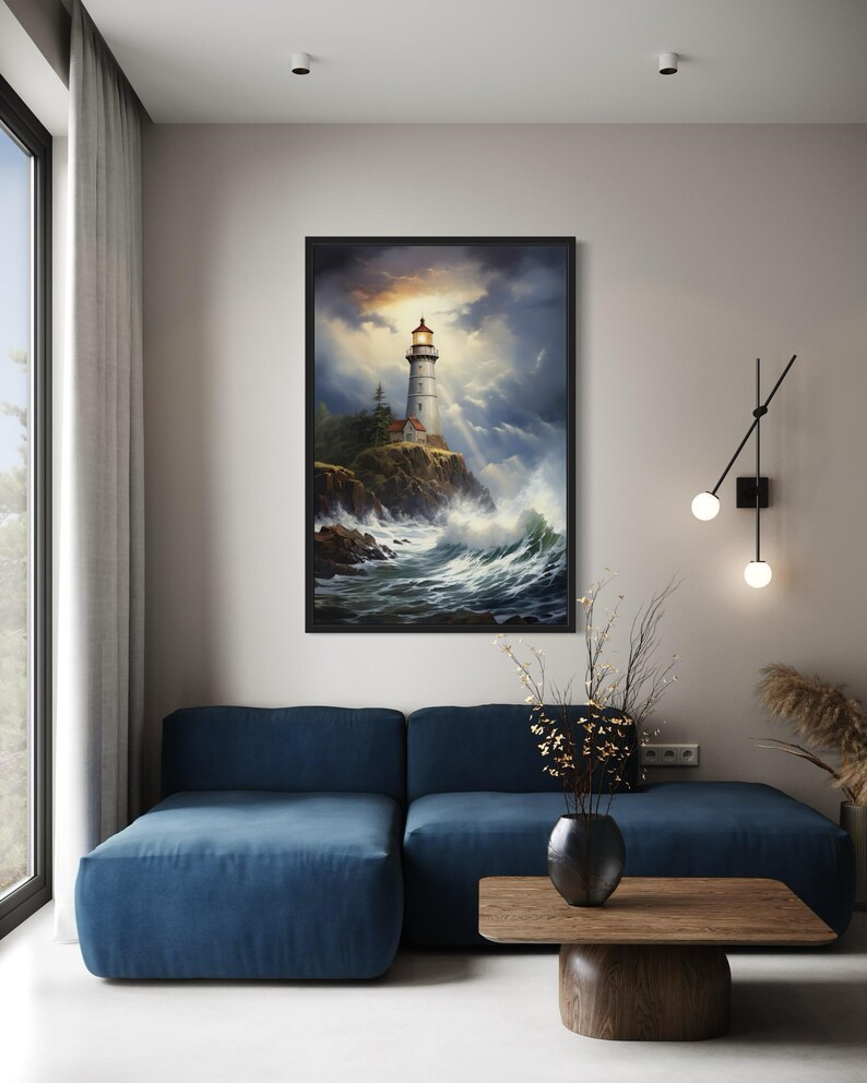 a living room with a blue sofa, a wooden coffee table, and a framed painting of a lighthouse on the wall.