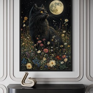 The image is a framed painting depicting a black cat sitting in a field of flowers and plants, with a full moon in the background.