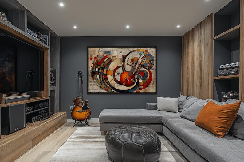 a modern living room with a large abstract painting on the wall, a guitar, a gray sectional sofa, and a wooden bookshelf.