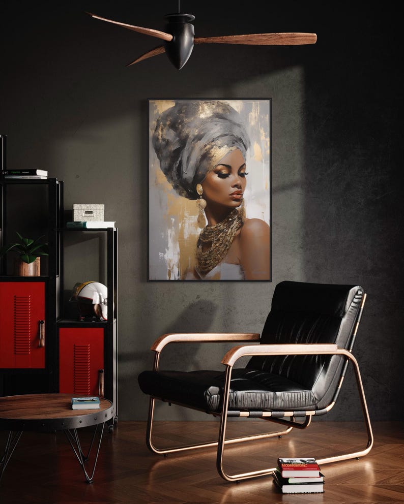 a modern living room with a black leather chair, a red cabinet, and a framed artwork of a woman with a headdress hanging on the wall.