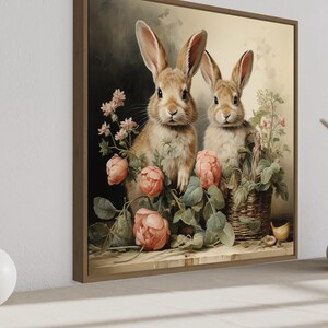 a painting of two rabbits sitting amidst flowers and plants, with a vase of flowers and a white vase on a shelf in the foreground.
