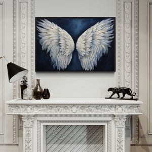 a white fireplace with a large painting of white wings hanging above it. The fireplace is decorated with various items, including a black cat statue, a vase, and a lamp.
