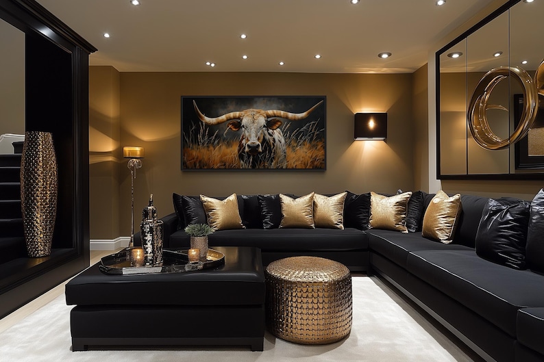 A luxurious living room with a large black sectional sofa, a coffee table, and a large framed painting of a bull on the wall. The room is decorated with gold accents, including a large mirror, a gold vase, and a gold-colored ottoman.
