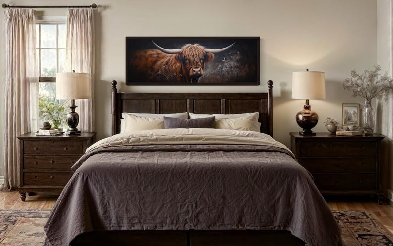a bedroom with a large bed, wooden furniture, and a framed painting of a bull on the wall.