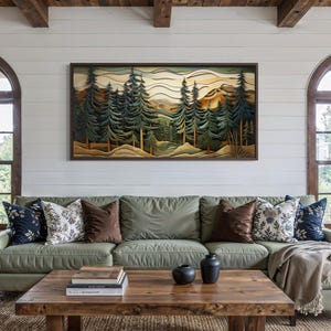 May include: A living room with a green sectional sofa, wooden coffee table, and a large framed landscape art piece. Two arched windows flank the artwork. Decorative pillows in various patterns and colors add to the room's aesthetic.