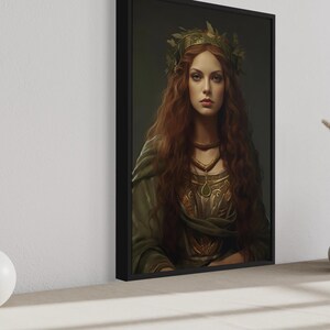a large framed portrait of a woman with long red hair and a crown, displayed on a wall. The portrait is surrounded by a few decorative items, including a white vase and a small white ball.