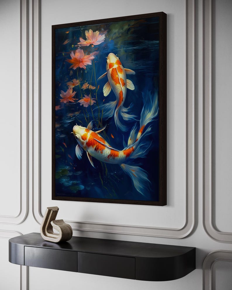 a framed painting of two koi fish swimming in a pond, surrounded by pink flowers.