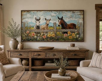 May include: A rectangular wall art print featuring a rustic wooden fence with two donkeys and a brown horse standing behind it in a field of colorful wildflowers under a blue sky. The artwork is framed in dark wood and displays a weathered texture.