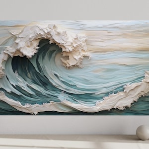 a large, intricately designed wave with a light blue-green color scheme, set against a white background. The wave appears to be made of paper or fabric, creating a visually striking and artistic representation of the ocean.