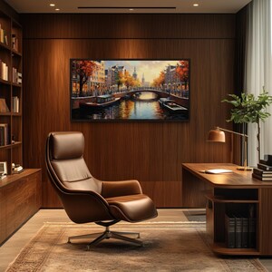 a modern and well-lit home office with a large wooden bookshelf, a comfortable leather chair, and a desk with a lamp. The room has a warm and inviting atmosphere, with a large painting of a cityscape on the wall.