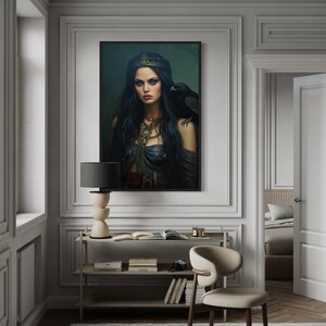 a large portrait of a woman with long dark hair and a crown, hanging on a wall in a room with a bookshelf and a chair.