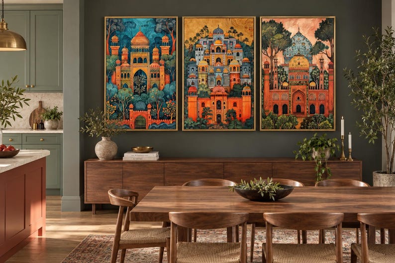 May include: A set of three rectangular wall art prints featuring intricate architectural structures with domes and arches in vibrant orange, blue, and gold tones, surrounded by stylized trees and foliage, each framed in a thin gold-coloured border.
