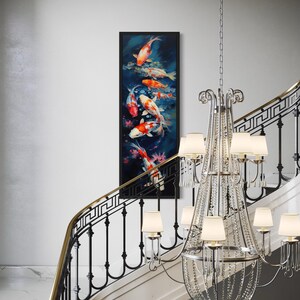 a staircase with a large, ornate crystal chandelier hanging from the ceiling, and a framed painting of colorful fish displayed on the wall above the staircase.