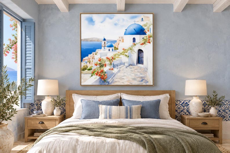 May include: A square wall art print featuring a Mediterranean coastal scene with white buildings, iconic blue domes, and vibrant orange bougainvillea flowers overlooking a deep blue sea under a bright, clear sky.