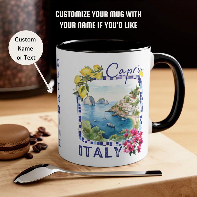 May include: White ceramic mug with a black rim and handle. The mug features a watercolor illustration of the Italian island of Capri with the text "Capri ITALY".