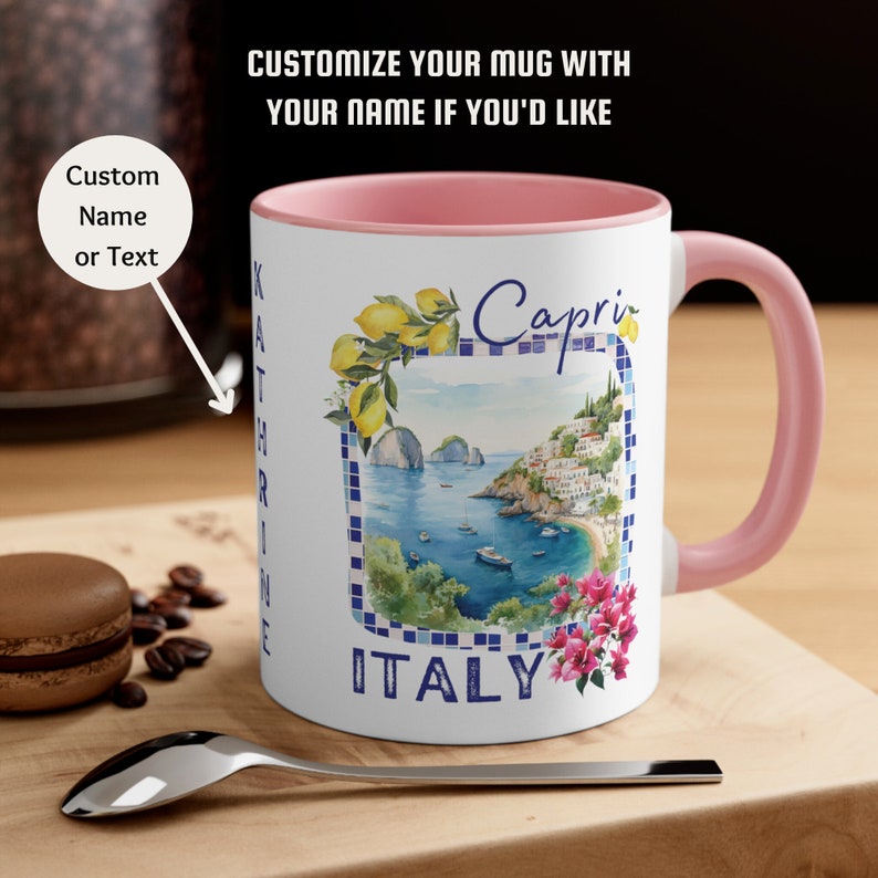 May include: White ceramic mug with a pink rim. The mug features a watercolor illustration of a coastal town with the text "Capri ITALY" and lemons. The text "Custom Name or Text" is visible in the background.