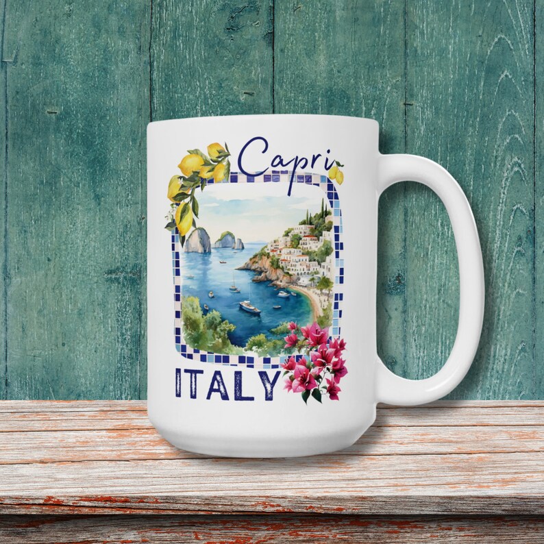 May include: White ceramic mug with a colorful illustration of a coastal town with the text "Capri ITALY" and lemons.