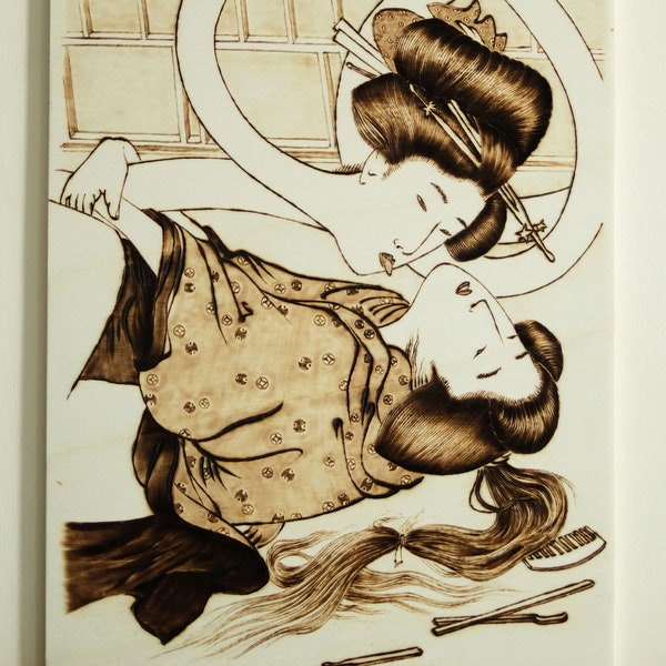 Pyrographie sur bois, faite à la main, inspirée de la shunga du maître japonais Kitagawa Utamaro.